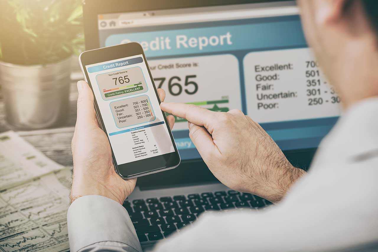 Man is checking his credit report online - Image