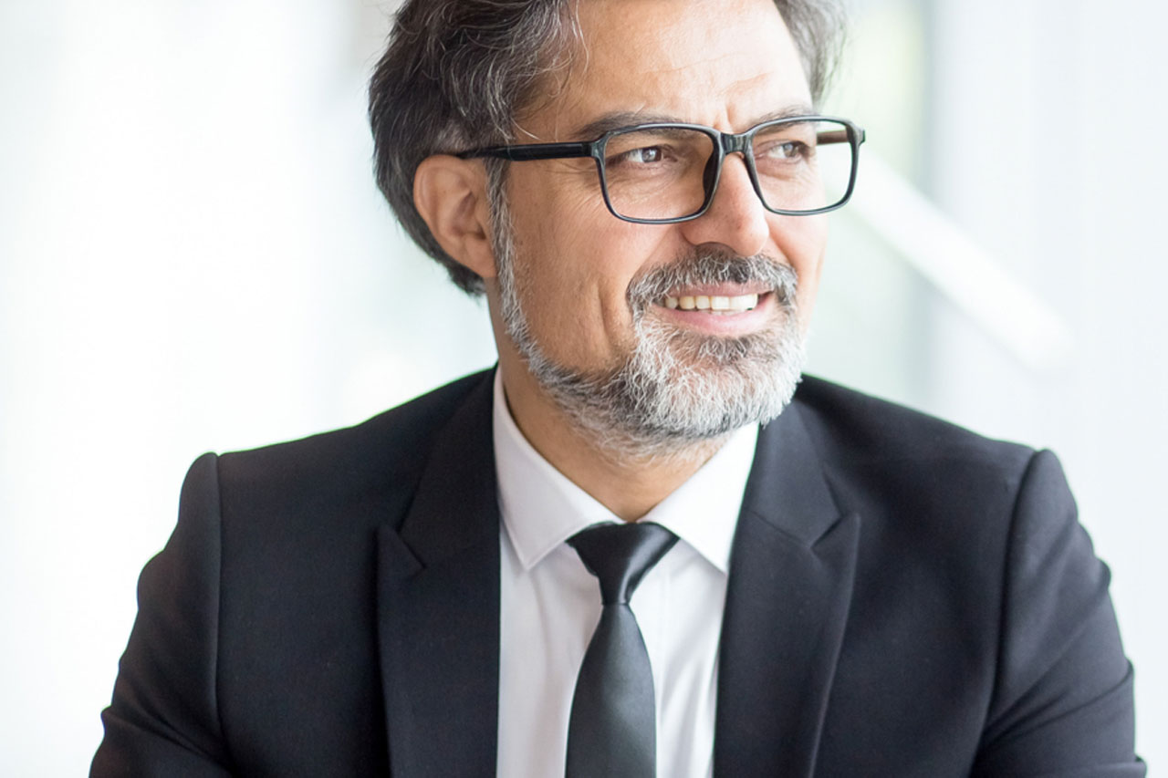 Thoughtful investor in suit making notes